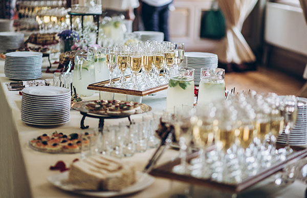 Table spread complete with champagne glasses and hors d'oeuvres for an elegant post-wedding brunch to celebrate with out of town guests